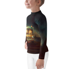 CB3-112 Kids Rash Guard in action at the beach with child playing