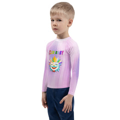 Child wearing Robin Hood’s Adventure Kids Rash Guard at the beach
