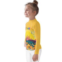 Sleeve detail of Pixie Dust Dreams Kids Rash Guard with star pattern.