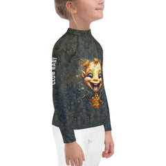 Kid happily playing in the water wearing the CB3-86 Rash Guard.