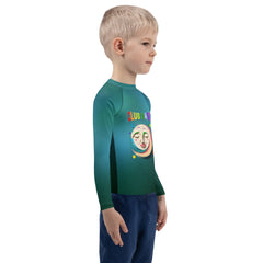 Child playing in the sand wearing Forest Friends Rash Guard
