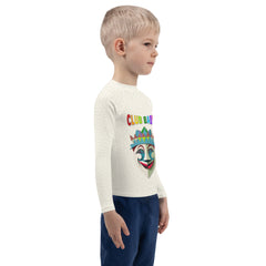 Child playing in the sand wearing Wizard's Castle rash guard






