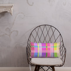 Rainbow Boxed Delight Pillow on a white couch.