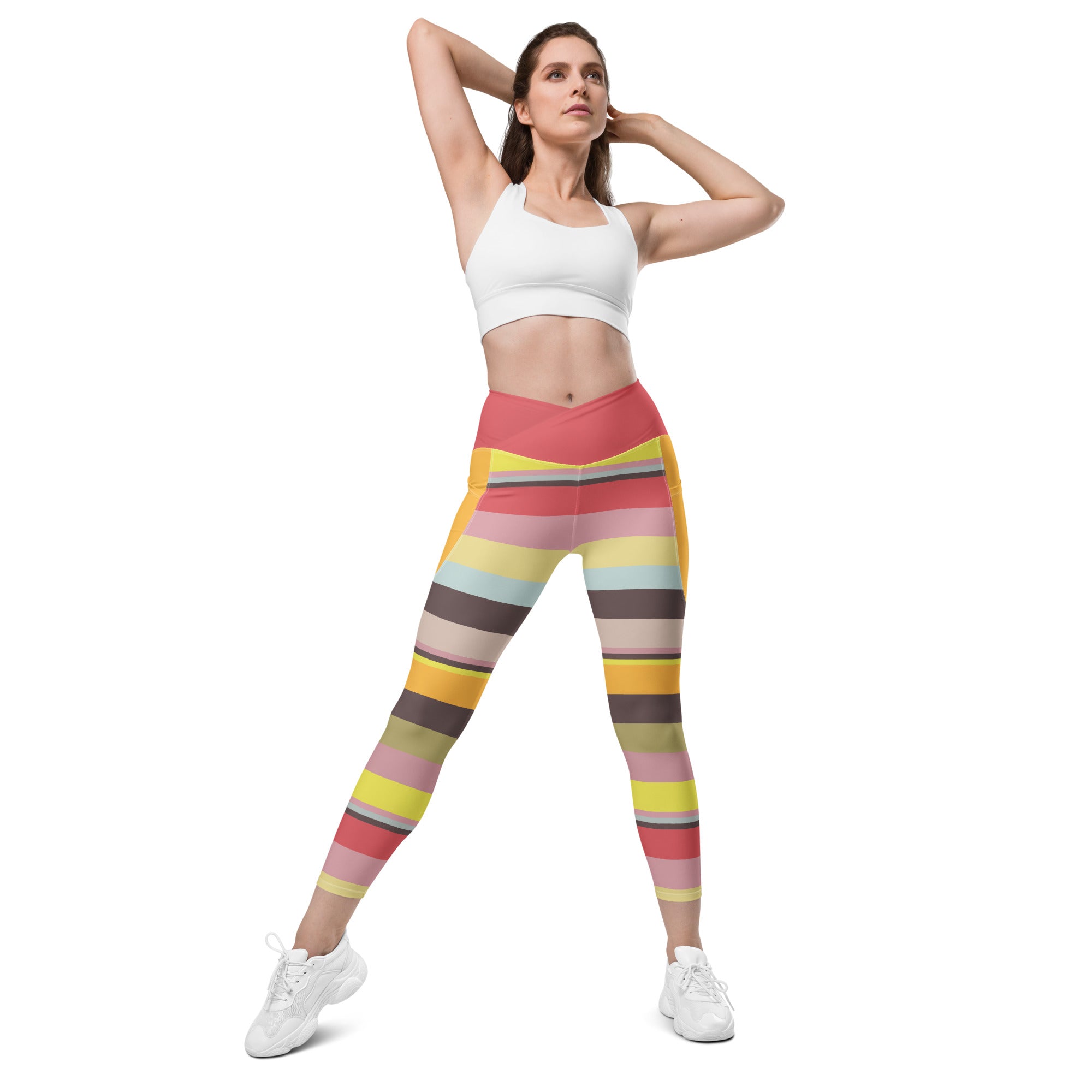 Vibrant sunrise pattern on Crossover Leggings with Pockets.