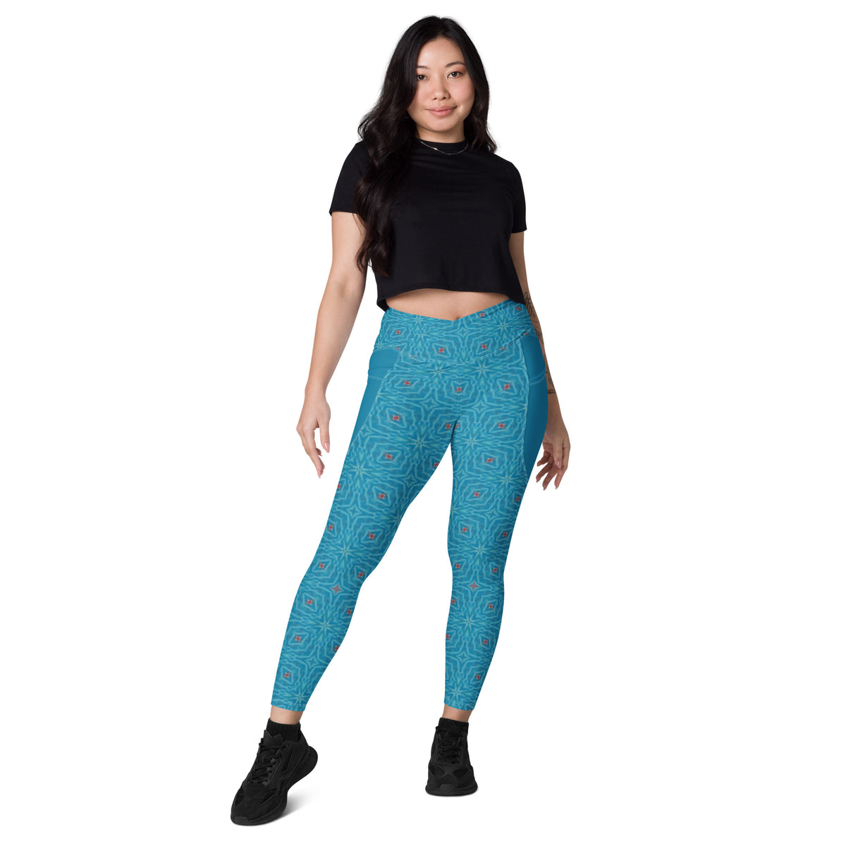 Striped Serenity leggings with crossover waistband and side pockets.