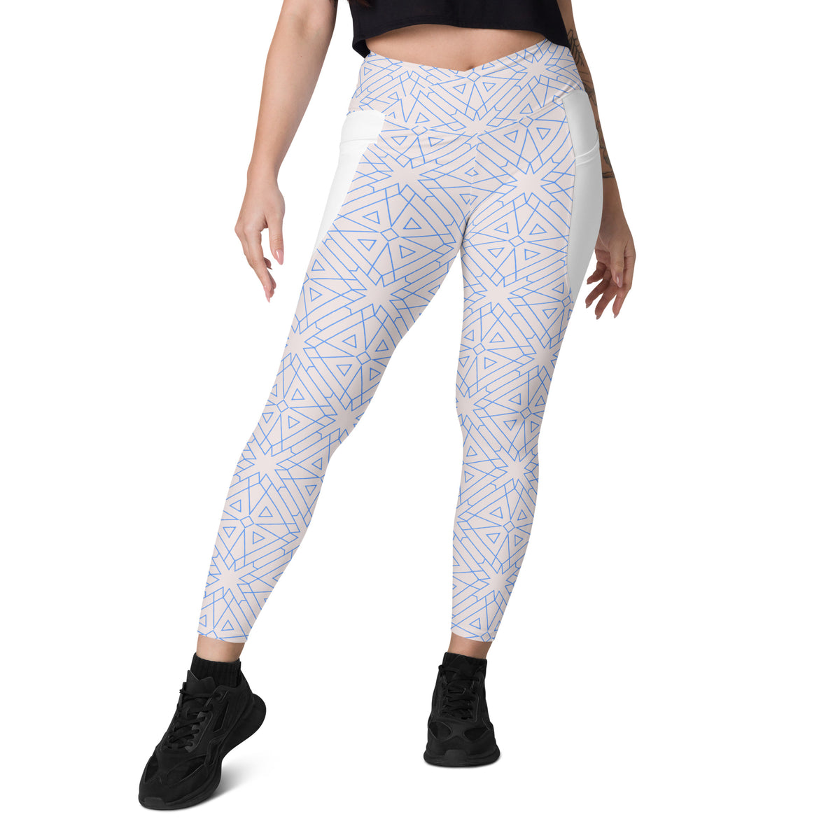 Cosmic Chaos pattern on crossover leggings with side pockets.