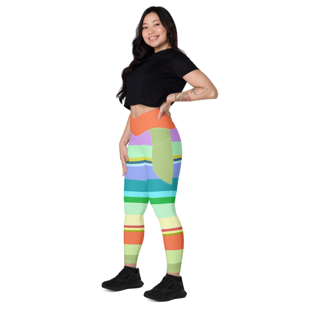 Retro Rainbow Blast Crossover Leggings on a model doing aerobics.