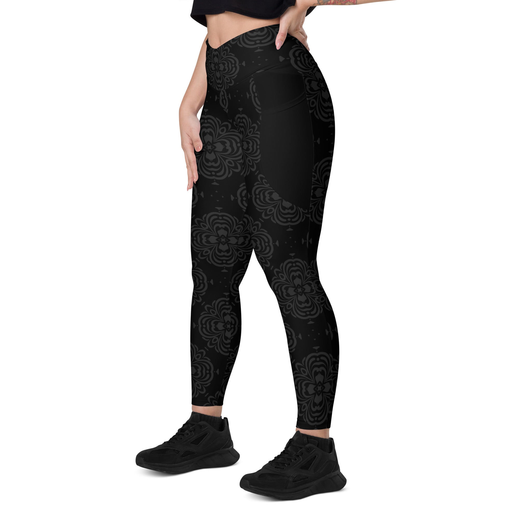 High-waisted camouflage leggings with crossover waistband detail.