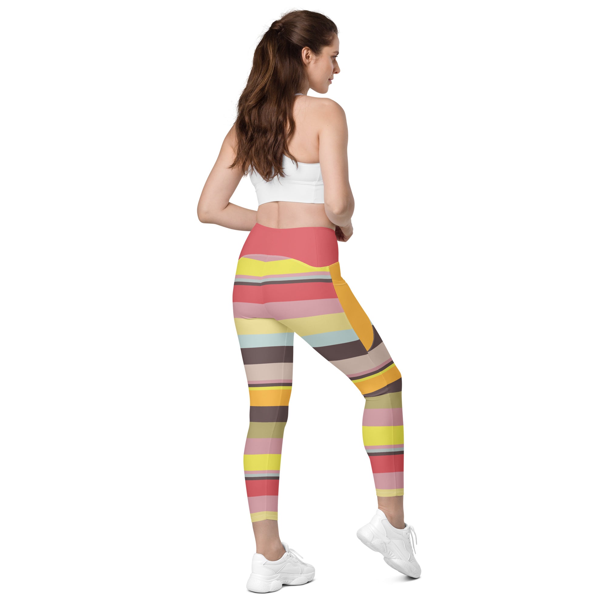 Folded view of Electric Sunrise Leggings highlighting the colorful design.