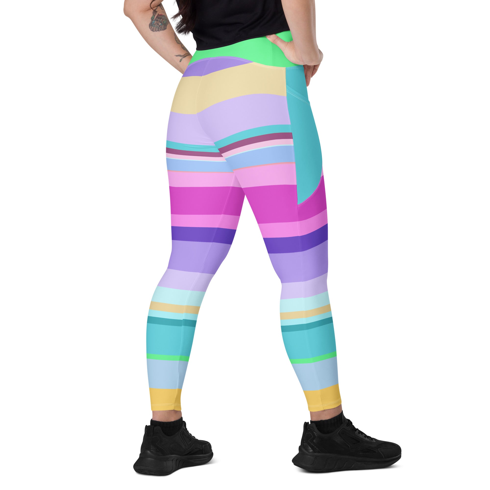 Laid flat Paradise Palette Leggings displaying the vivid color scheme.