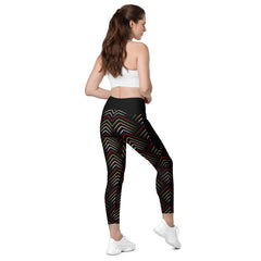 Fashionable woman posing in crossover ethnic print leggings.