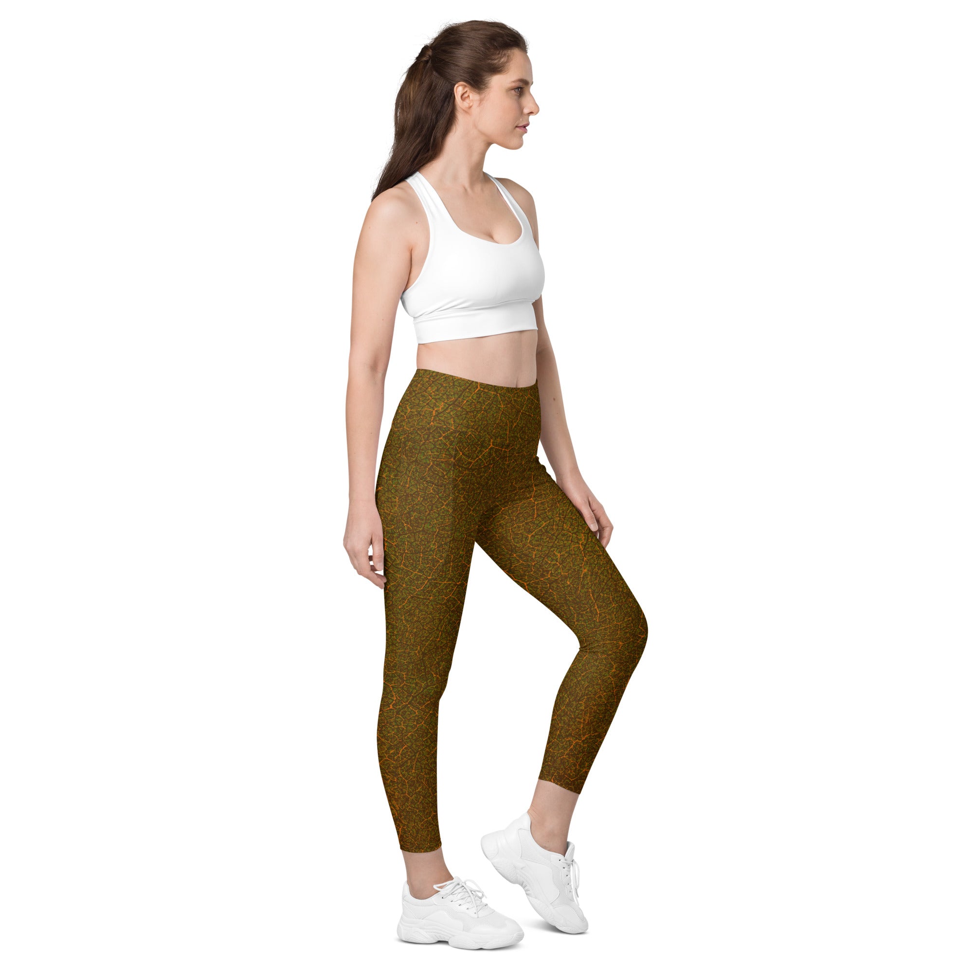 Stylish and functional earthy foliage leggings, featuring leaf textures and pockets for the outdoorsy woman.