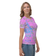 Woman wearing Kaleidoscope Dreams T-Shirt with a colorful background.