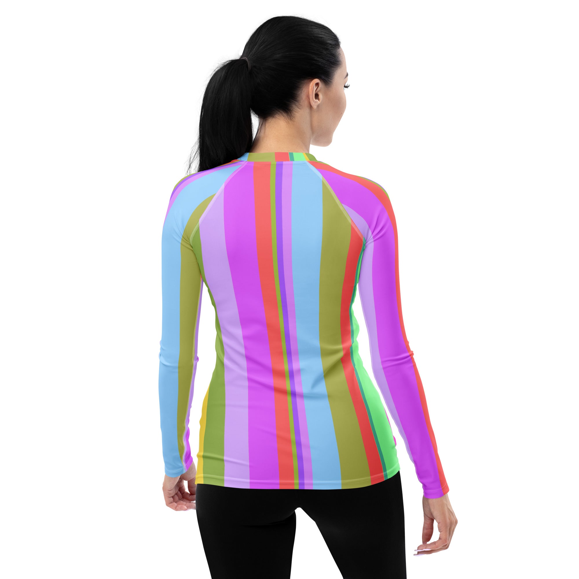 Close-up of Sunset Serenade Rash Guard material, showcasing stretch and comfort fit for women.