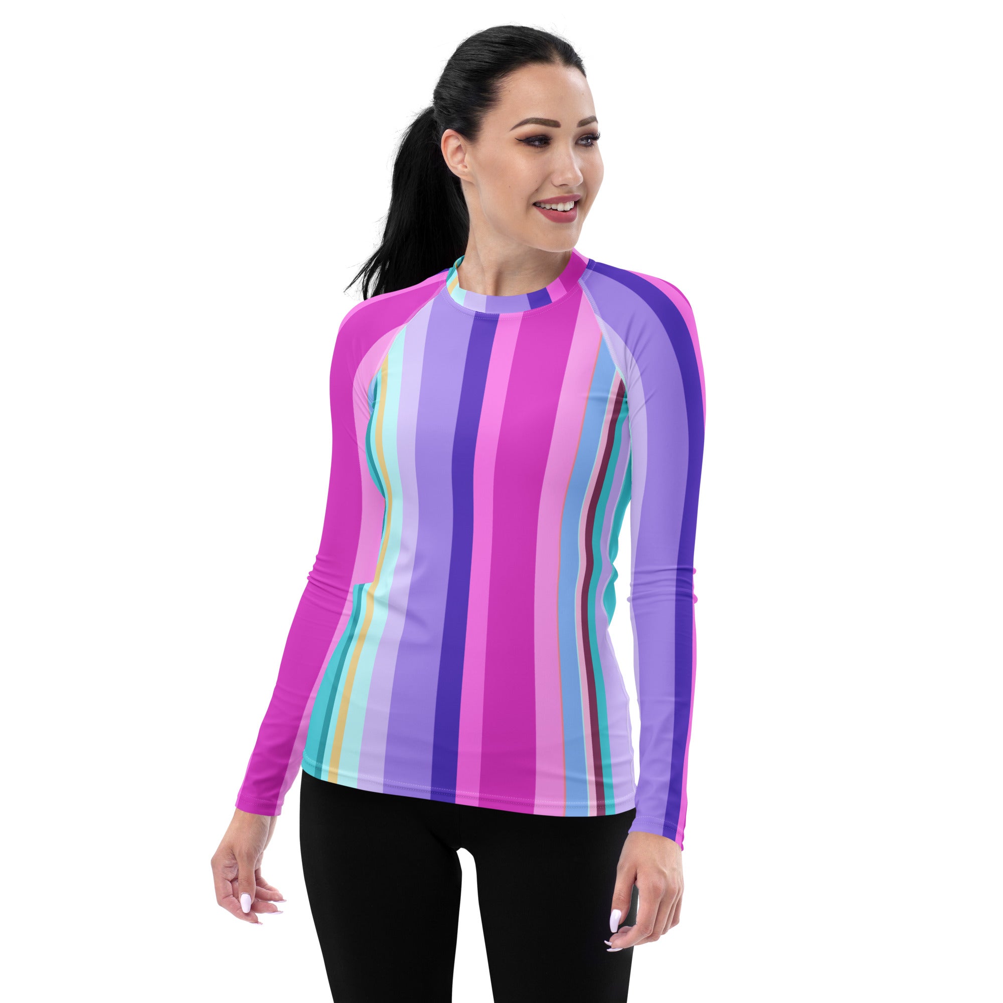 Woman wearing Tropical Tango Rash Guard enjoying surfing, highlighting durability.