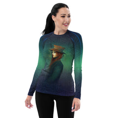 Action shot of a woman in Horizon's Horizon rash guard swimming