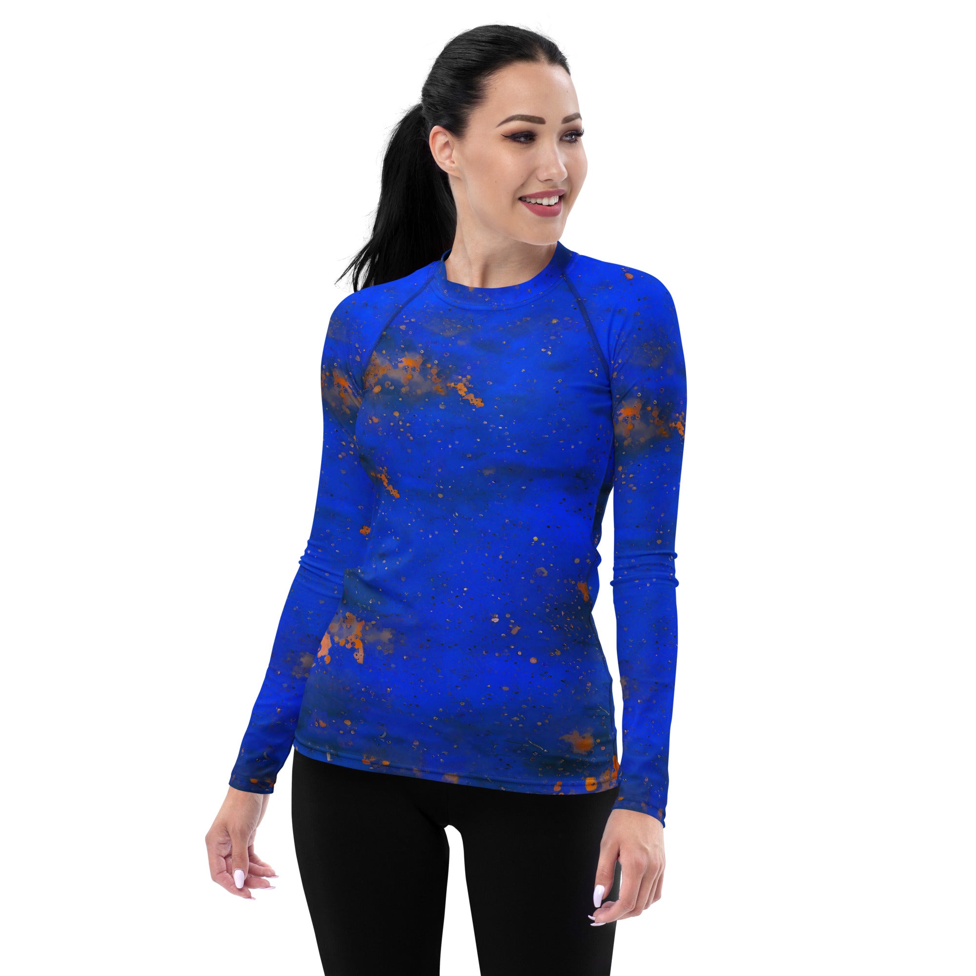 Women's rash guard with vibrant paint splashes design.