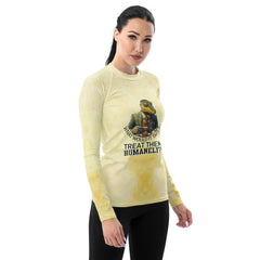 Playful penguin party rash guard for women laid flat.