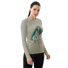 Stylish woman in pop culture themed rash guard, ideal for beach and pool.