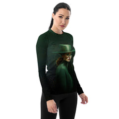 Active woman surfing wearing Futuristic Flair rash guard