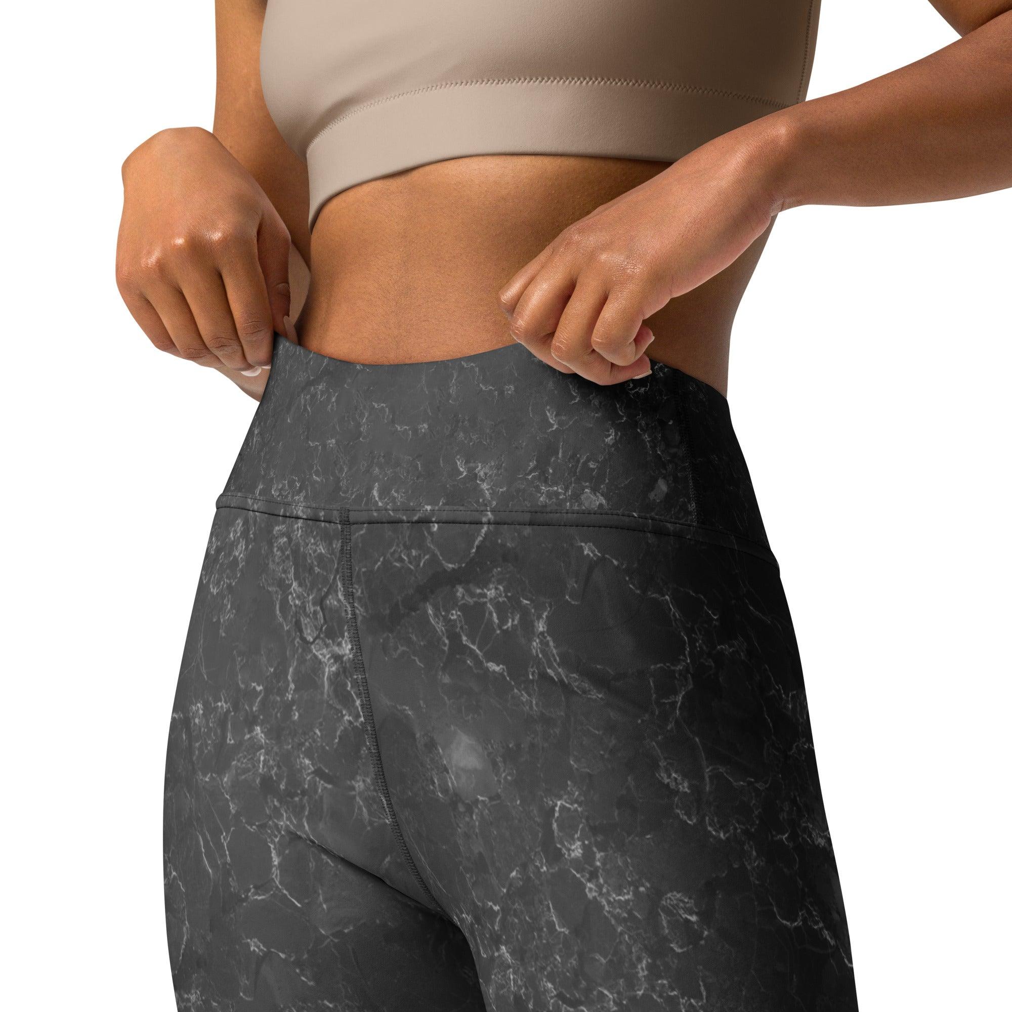 Close-up of grey yoga leggings fabric texture.