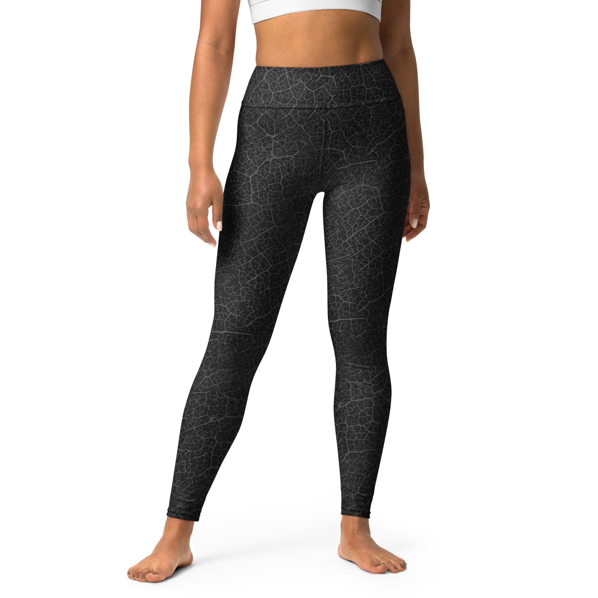 Practicing yoga in Serene Leaf Texture Yoga Leggings, showcasing their nature-inspired design and superior stretch.