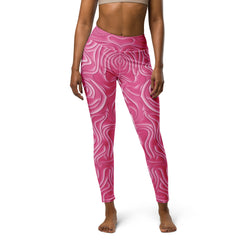 Model wearing Sunset Serenade All-Over Print Yoga Leggings while stretching.