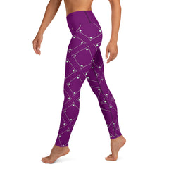 Cosmic Connection Yoga Leggings paired with yoga mat in studio setting