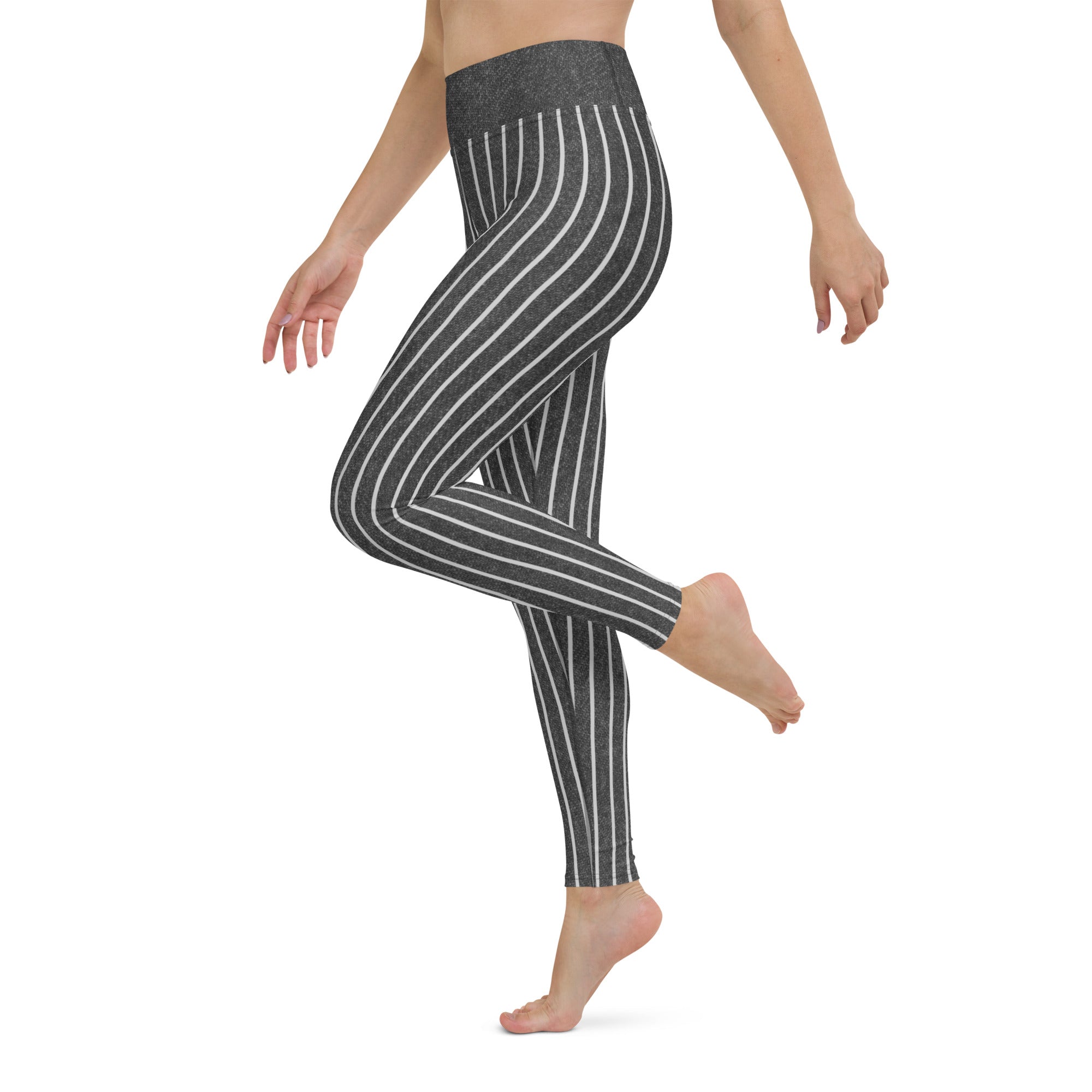 Practicing a yoga pose in Midnight Indigo Yoga Leggings, emphasizing their flexibility and snug fit.