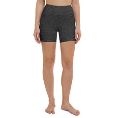 Engaging in yoga poses wearing Tranquil Leaves Yoga Shorts, featuring a serene leaf design for a peaceful practice environment.