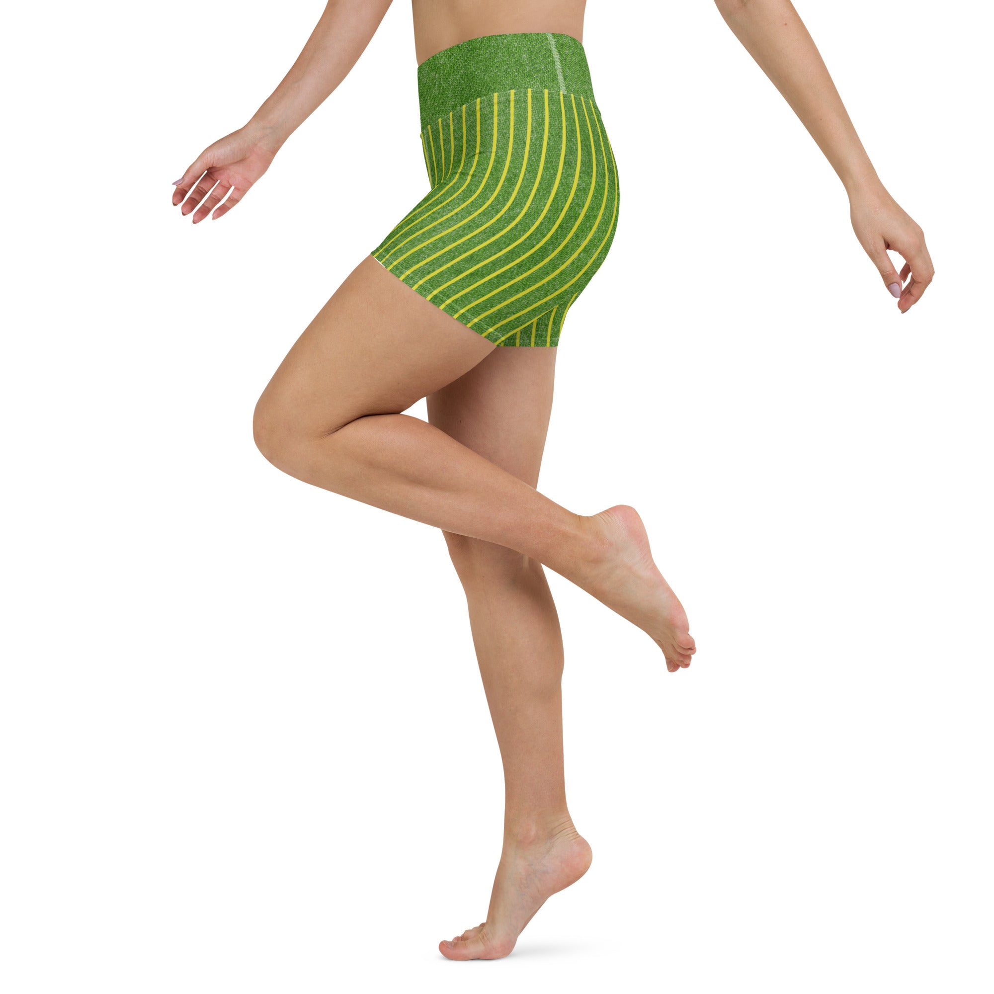 Woman wearing Indigo Stripe Yoga Leggings performing a balance pose, emphasizing their flexibility and support.
