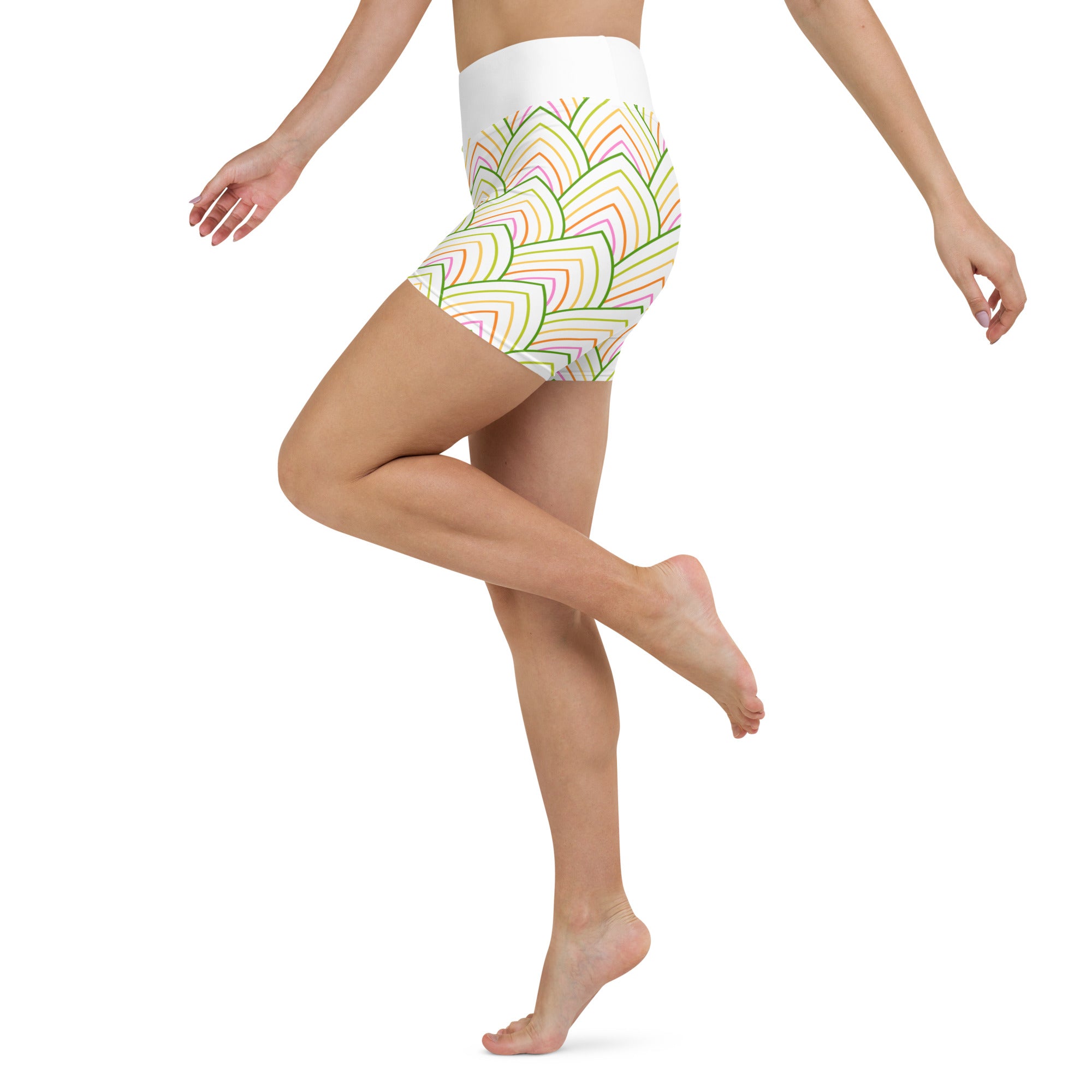 Pair of Tropical Escape Yoga Shorts laid out on a flat surface