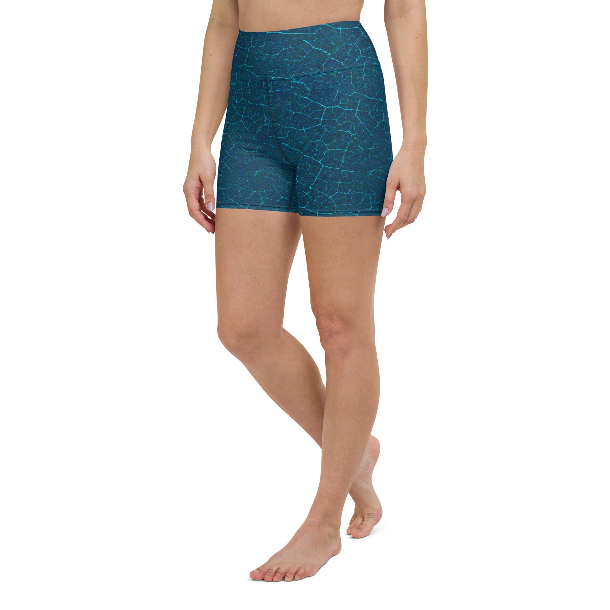 Detail of Zen Garden Escape Yoga Shorts on a yoga mat, emphasizing their design and suitability for a focused yoga session.