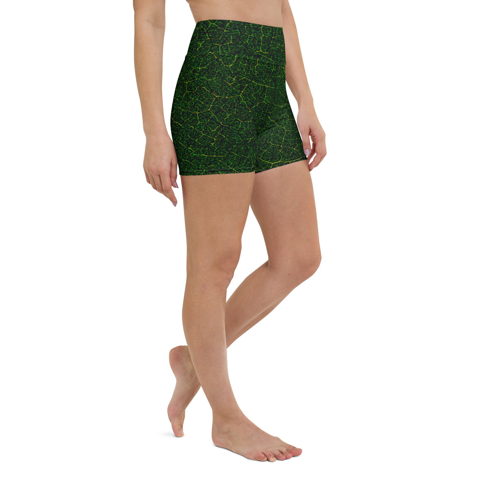 Engaging in yoga poses wearing Forest Serenity Yoga Shorts, with the tranquil forest design enhancing the peaceful session.