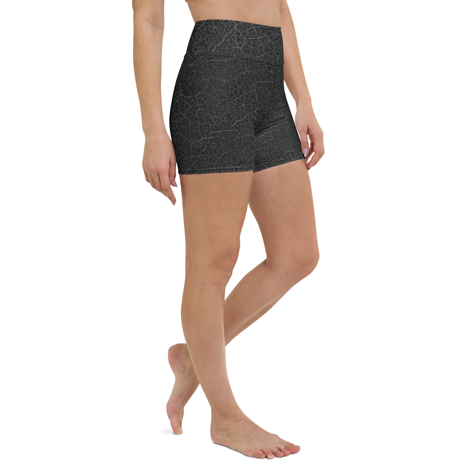 Tranquil Leaves Yoga Shorts in a yoga studio setting, emphasizing their suitability and style for a variety of yoga forms.