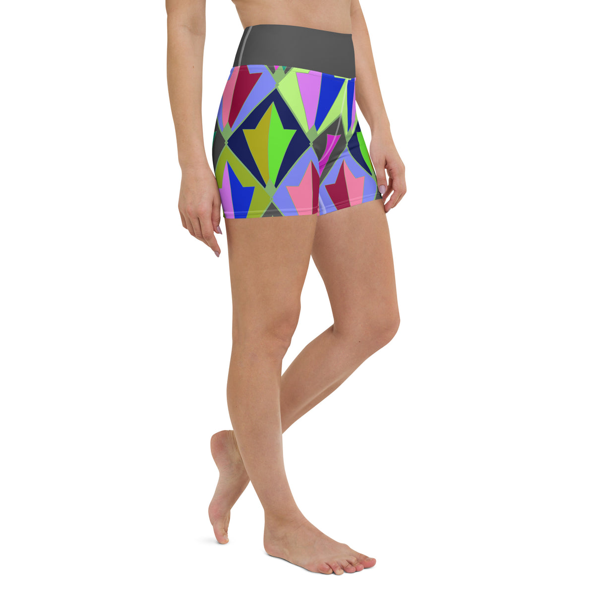 Whispering Vines All-Over Print Yoga Shorts on a clothing mannequin.