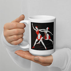 Artistic white tea mug with dance-inspired artwork.