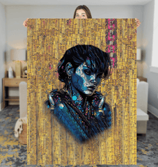 Artistic Adventure Sherpa Blanket draped over a sofa in a cozy room.