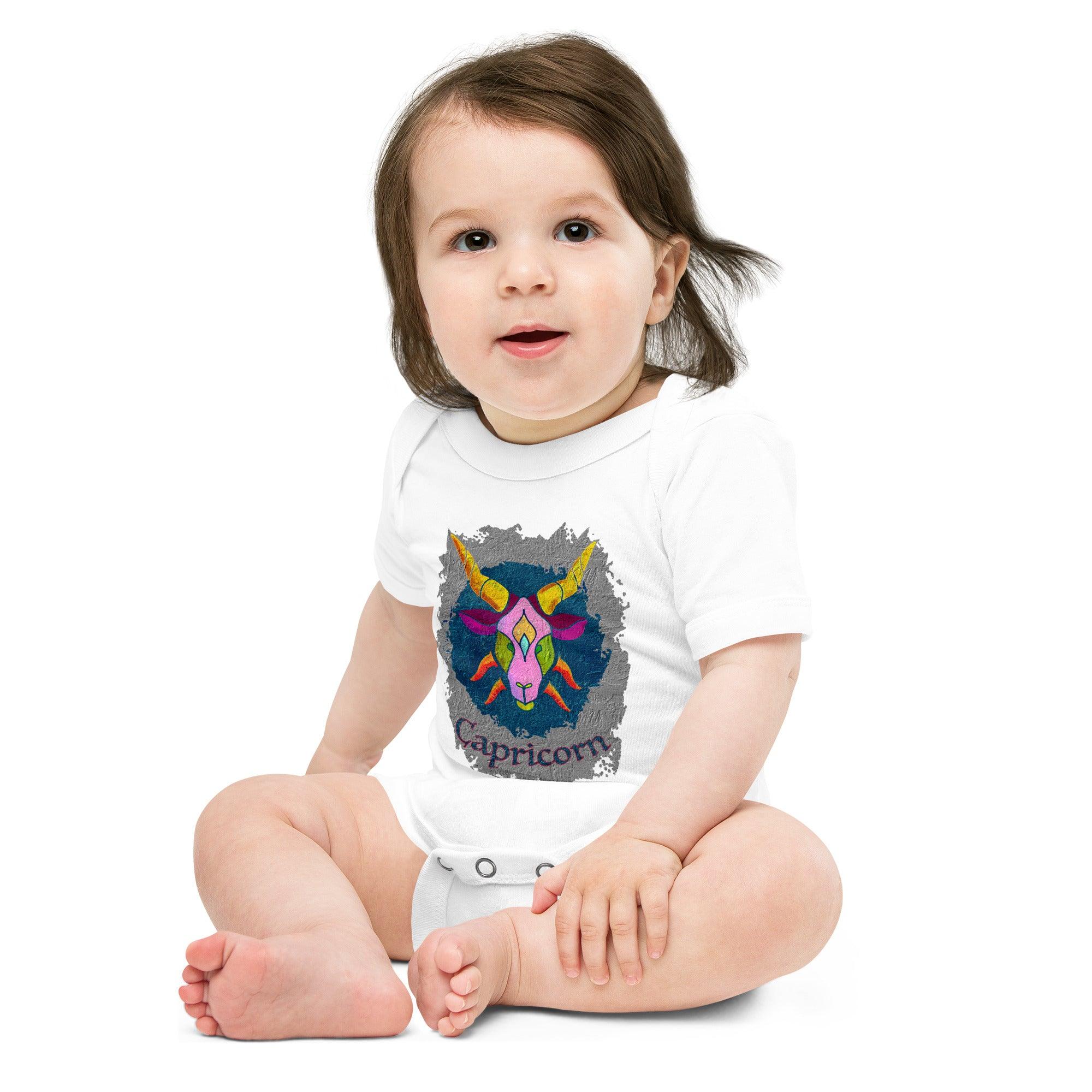 Soft fabric baby one-piece with Capricorn print, short sleeves.