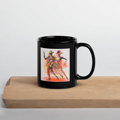 Balletic Dreamland black glossy mug on a white background.