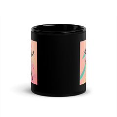 Black glossy mug with intricate balletic flourishes for a stylish drinkware choice.