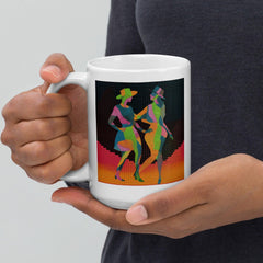 Hand holding Balletic Intimacy Attire white glossy mug, showcasing its sleek design.