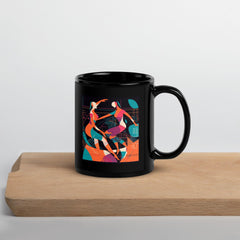 Balletic Reverie glossy black mug on wooden table.