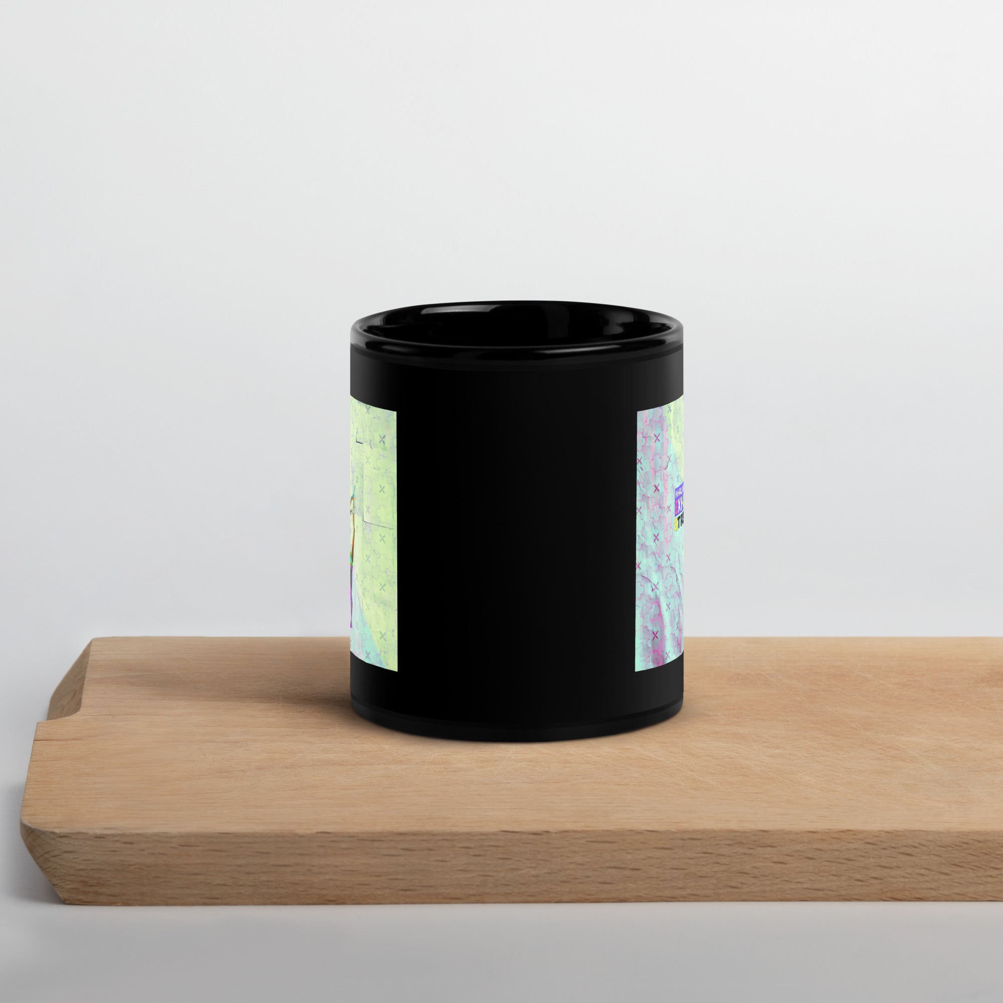 Black coffee mug with calming Lotus Pose artwork.