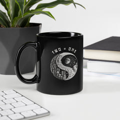 Black glossy mug with Yin Yang harmony design.