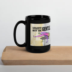 Flexible yoga pose themed black glossy mug.