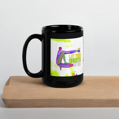 Inspirational Camel Pose design on black coffee mug.