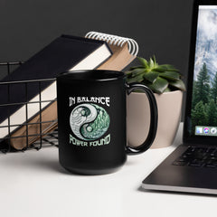 Mystic Moons design on a sleek black coffee mug.