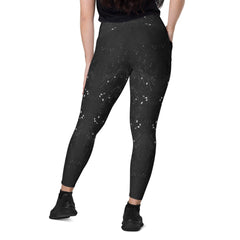 Stylish black leggings with snake design and crossover waistband.
