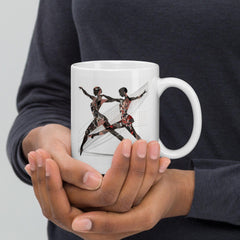 Close-up of white glossy mug with dance-themed design